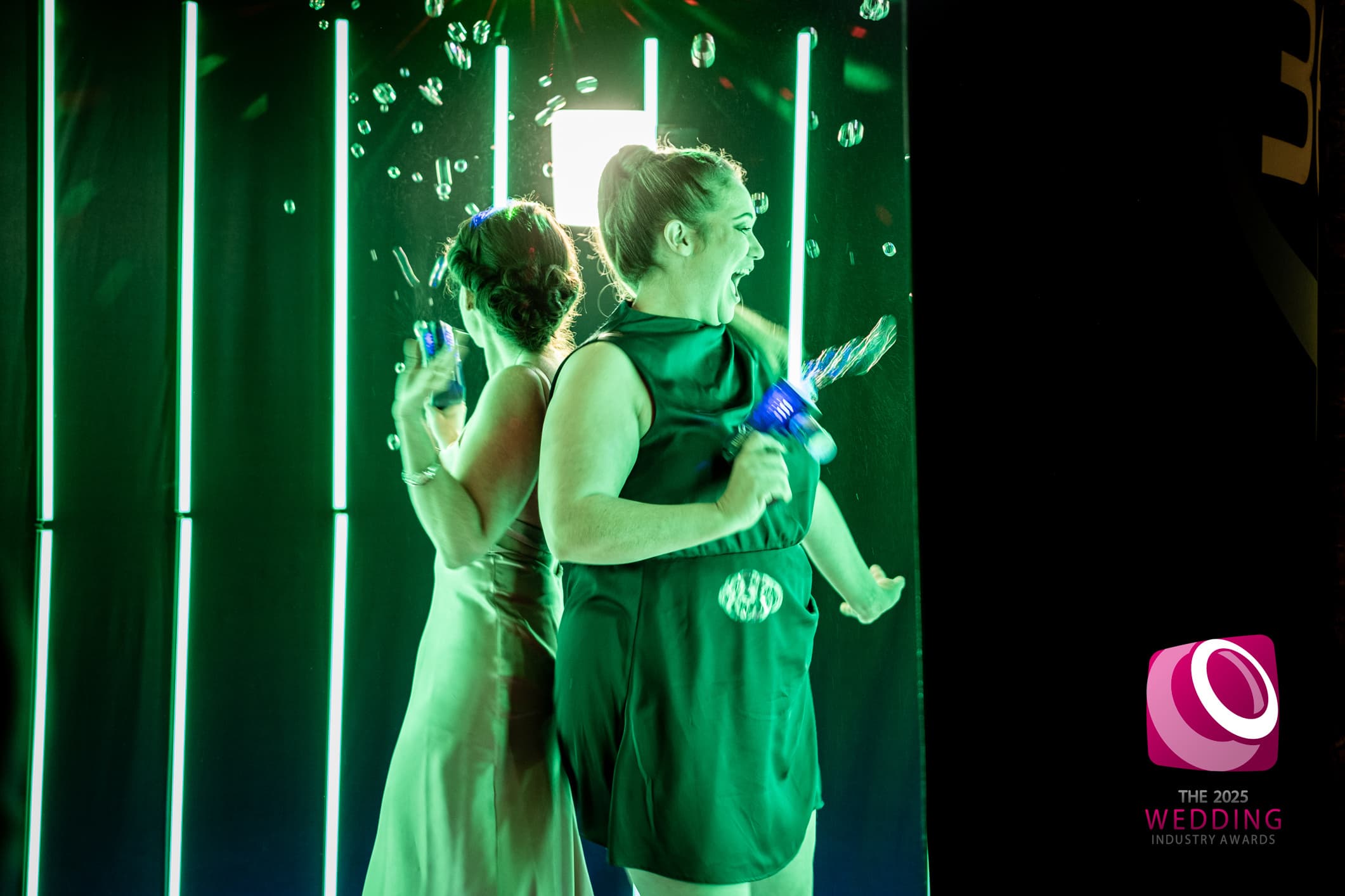 360 photo booth slow-motion capture lit in green RGB lighting