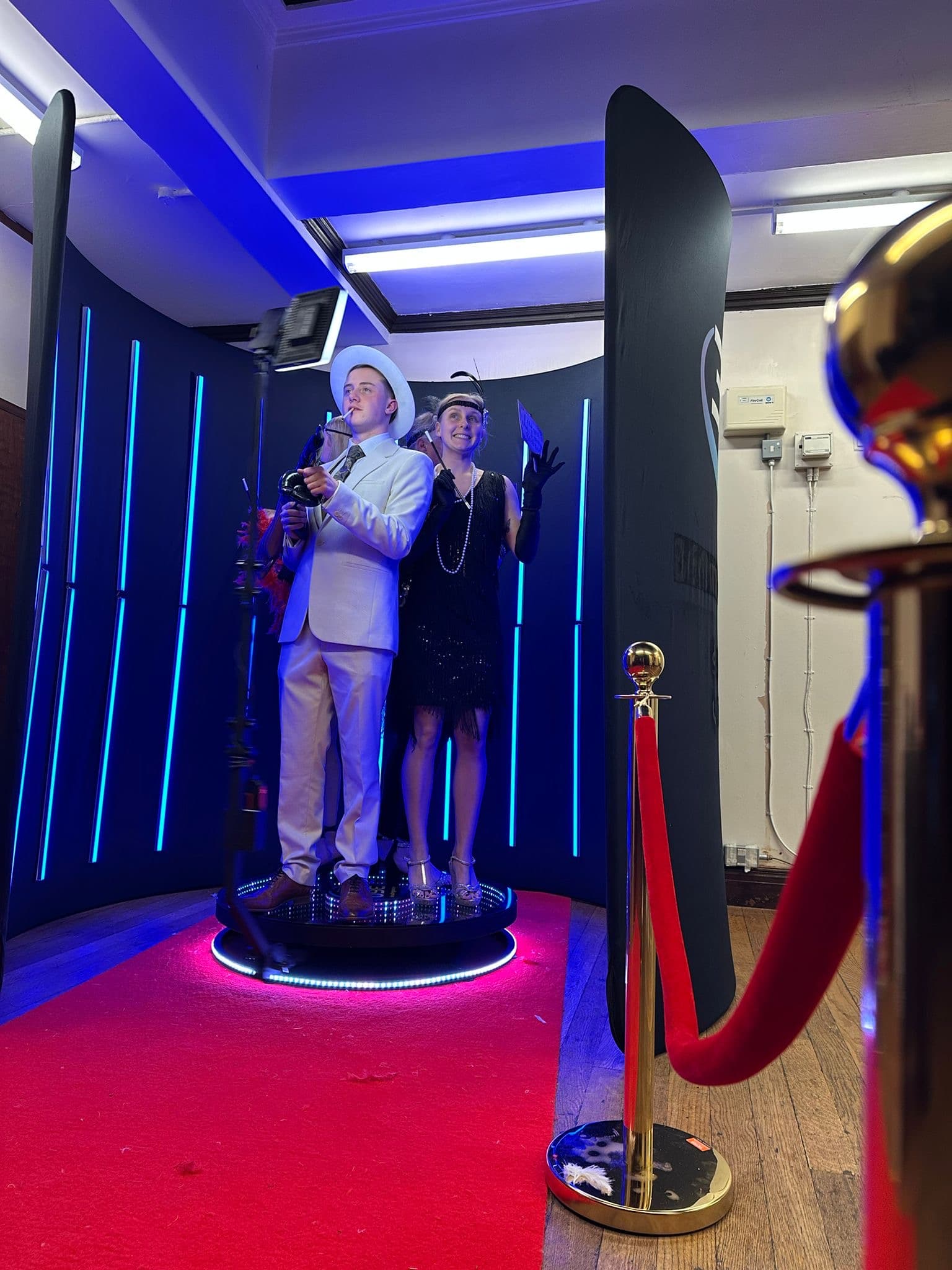 Guest in costume on a 360 photo booth at a themed party